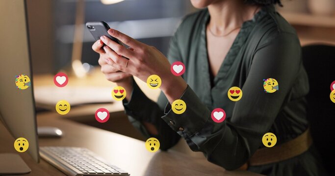 Hands, woman and phone with emojis in office for social media, like post and followers reaction. Person, mobile and overlay icons of online interaction, review comments and chat notification at night