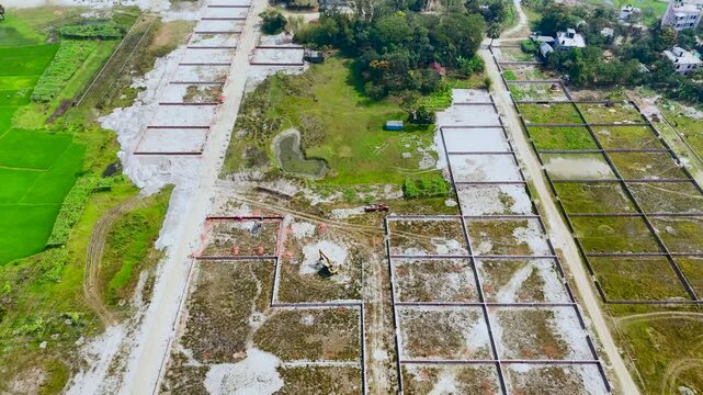 Aerial view of a residential construction site showing plots of land under development