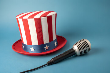 Uncle Sam Hat and Microphone Against Light Blue Background