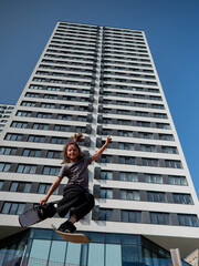 Girl practices skiing tricks on a trampoline. 