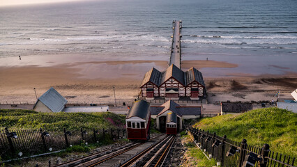 Saltburn Cliff Tramway descending to Saltburn Pier and beach at sunset in Saltburn by the Sea, United Kingdom