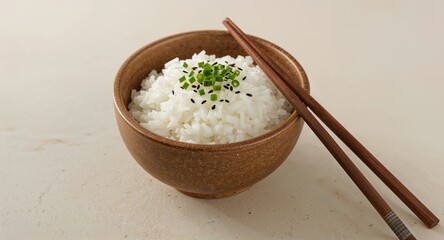 A stack of three powdered donuts, the top one with a bite taken out, on a wooden cutting board
