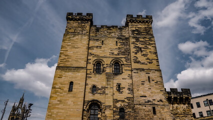 Low angle view of the castle keep rising towards a cloudy sky in Newcastle upon Tyne, England