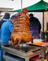 Delicious Roasted Meat on Rotating Spit at Street Food Stall, Grilled Food Concept, Popular Street Food, Outdoor Market, Tasty Meal, Food Preparation
