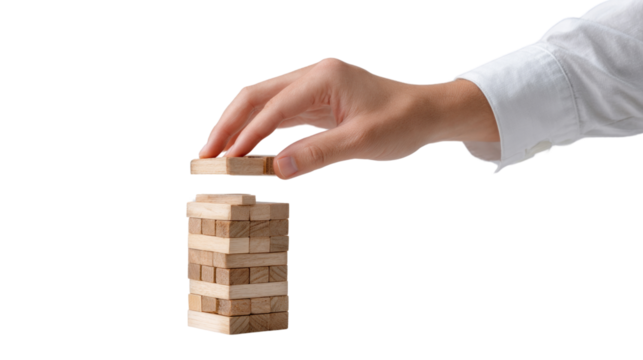A hand is holding a piece of wood that is part of a puzzle