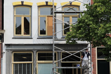Luttik Oudorp Street House Facade Detail Witf Scaffolding and Painter in Alkmaar, Netherlands