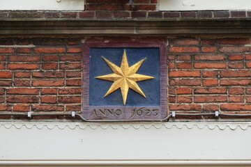 Gable Stone with Golden Star Decoration and 1623 Inscription in Alkmaar, Netherlands
