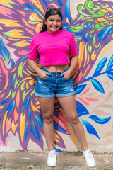 Fashionable Latina Model Posing Confidently by Graffiti Wall