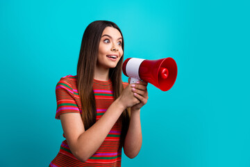 Young woman holding a red megaphone, expressing excitement against a vibrant turquoise background