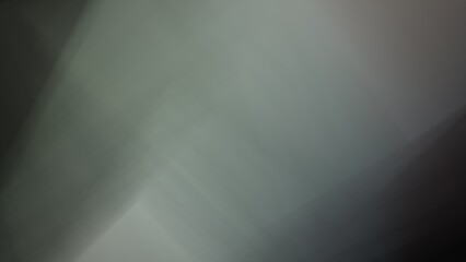 Soft, overlapping translucent shapes in shades of gray and white create a serene, abstract composition. The gentle interplay of light and shadow adds depth and a sense of quiet elegance.