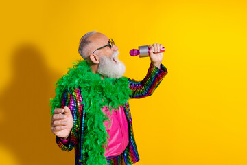 Photo of elderly cool old man sing microphone mic wear stylish striped suit boa sunglass isolated...