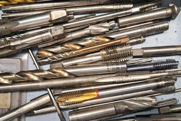Metal taps and cutters. Industrial precision tools. Threading cutting equipment. Engineering...