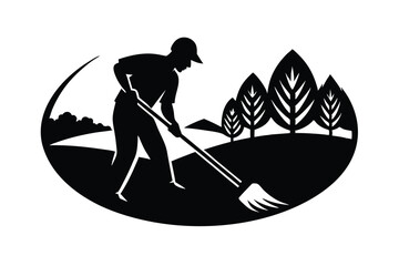 Person Raking Leaves in Landscape