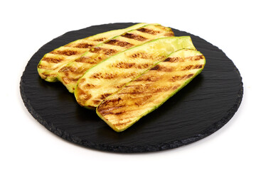 Grilled Zucchini Slices on Slate, isolated on white background