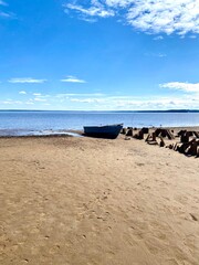 A boat on the riverbank. A sunny day.