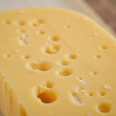 Image depicting Emmental cheese with intricate details highlighting its distinctive texture