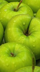Fresh dew-kissed green apples highlighted by intricate details revealing their vibrant hues and succulent textures