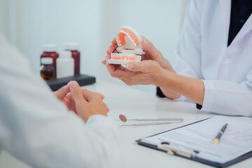 Dentist gives interesting advice about dental health, young man, focusing on oral health and dental care, dental or dental health concept.