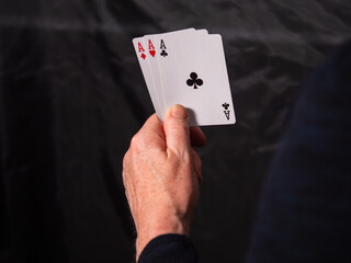 Obraz premium Poker player holding aces playing cards 
