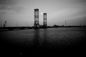 Basra, Iraq - June 19, 2025: A drawbridge stands stark against the twilight sky

