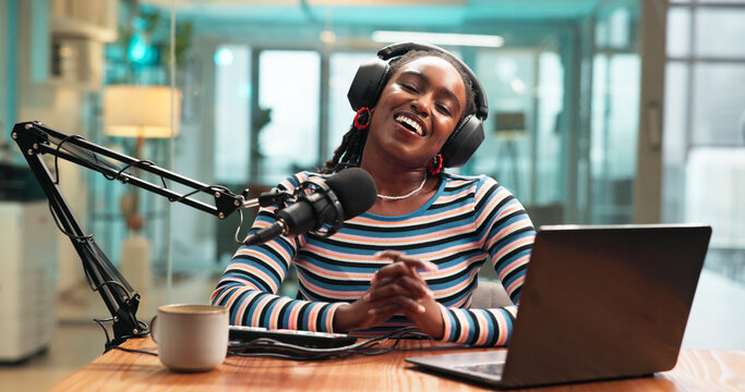 Talking, headphones and black woman on broadcast with microphone for podcast or radio host. Laptop, happy person and live streaming in studio for production, content creation for social media or POV