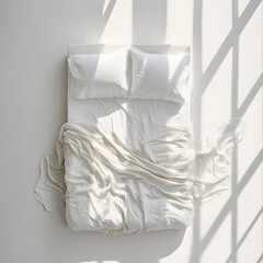 Obraz premium Aerial view of a bed with white bedding 