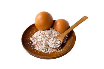 Broken or Crushed Egg Shells on Wood plate.