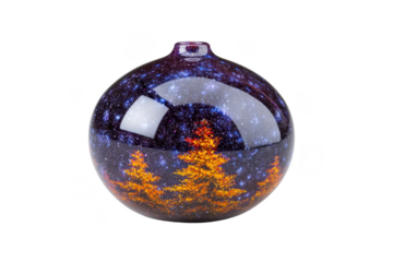 Round glass ornament features cosmic design with vibrant orange trees against starry night sky, creating festive and enchanting atmosphere