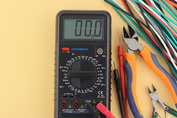 A digital multimeter for measuring the parameters of electrical circuits. 