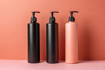 Three cylindrical plastic bottles
