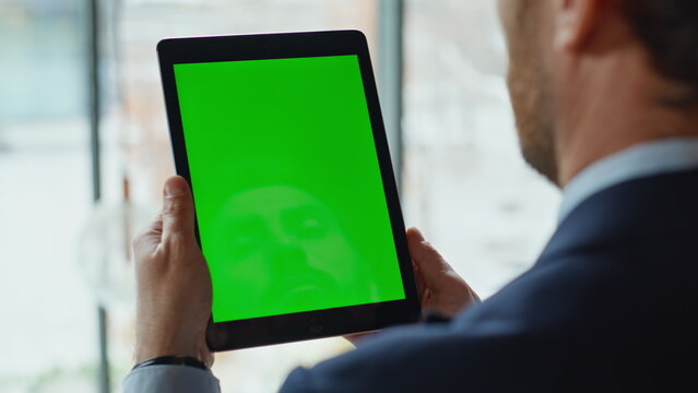 Ceo looking chromakey tablet reading financial report in office closeup.  - Powered by Adobe