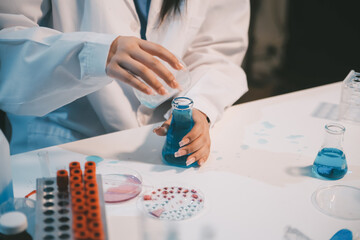 Research, experiment and medical trial being done by a scientist in a lab, science facility or...