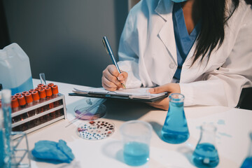 Research, experiment and medical trial being done by a scientist in a lab, science facility or...