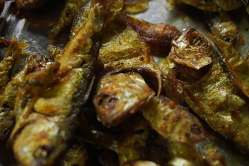 Crispy fried fish with golden-brown coating and tender, flavorful meat, perfect for seafood lovers, served hot with sauces or side dishes