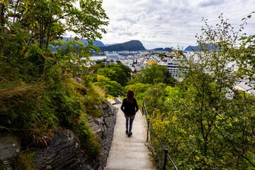 Fototapeta premium Young woman in Alesund city from view point, Norway, Europe