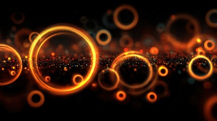 Obraz premium A series of orange circles are scattered across a black background. The circles are of varying sizes and are arranged in a way that creates a sense of movement and energy. Scene is dynamic and lively