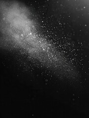 Obraz premium Black matte textured background with floating dust particles illuminated by soft light in the top right corner, creating a deep contrast between black and white. This abstract design emphasizes textu