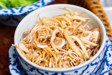 Fresh banana blossom sliced in ceramic bowl