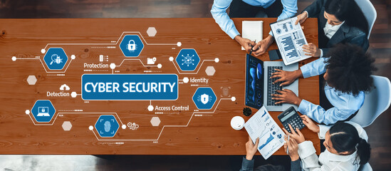 A diverse team collaborates on a cyber security project, utilizing data analysis tools to enhance protection and detection strategies in digital environments. Amity