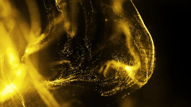 Golden glitter background in slow motion. Beautiful transition with real gold particles flying in wind on black background, shot with depth of field. Gold dust bokeh abstract background
