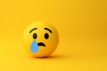 Sad emoji crying with one tear on yellow background