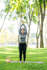 Woman Practicing Yoga in Park
