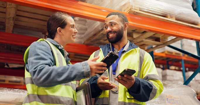 Man, woman and phone at warehouse, logistics or happy for storage, talk or supply chain management. People, team and smartphone with smile for application, strategy and notification at shipping plant