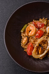 Rice and prawns or paella, a meal with seafood and vegetables. Cooked rice with shrimp