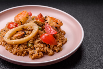 Rice and prawns or paella, a meal with seafood and vegetables. Cooked rice with shrimp