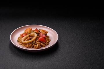 Fototapeta premium Rice and prawns or paella, a meal with seafood and vegetables. Cooked rice with shrimp