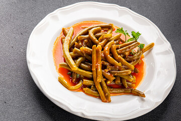 Green bean tomato sauce fresh gourmet food background on the table rustic top view copy space keto and paleo diet vegetarian and vegan food