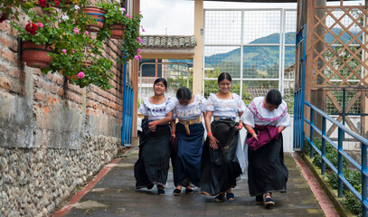 Indigenous ecuadorian women dancing traditional dance in otavalo