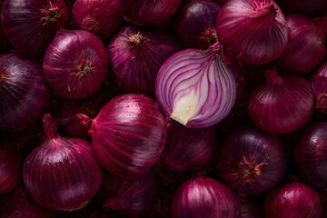 A pile of red onions, with one sliced open to reveal the center. The background is dark and full of vibrant purple onions
Vibrant red onion heap, a close-up