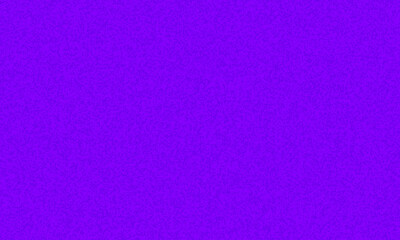 Bright purple texture featuring subtle noise creates a vibrant, eyecatching monochrome background...